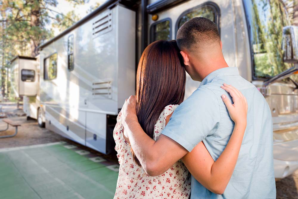 Couple looking at their new recreation vehicle after home inspection services were provided